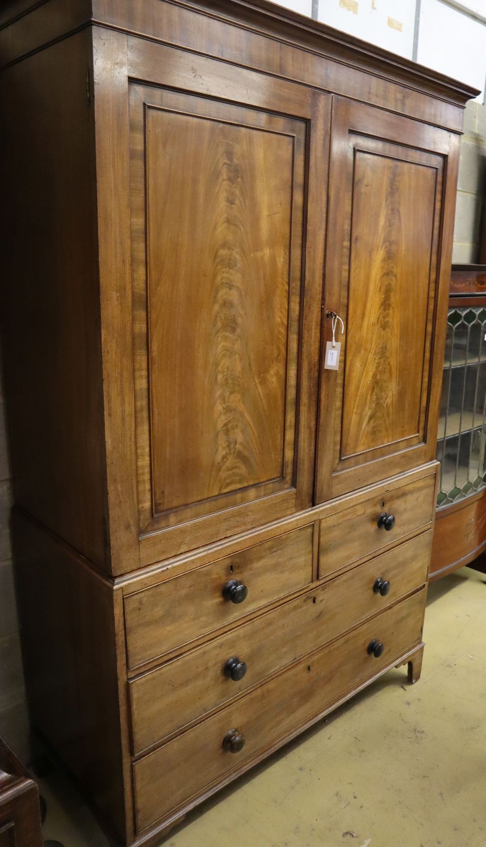 A Regency mahogany linen press, W.124cm, D.52cm, H.200cm